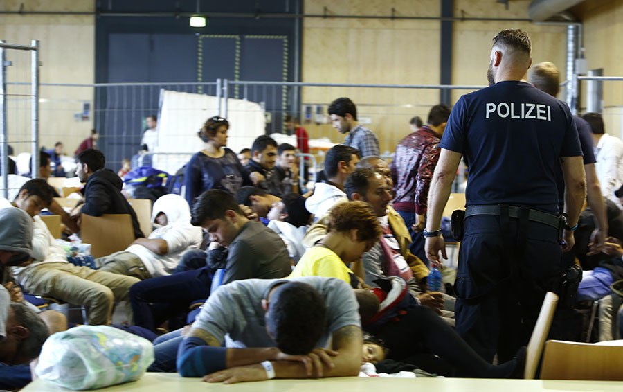 Refugees welcome? Merkel flip flops on migrants as chancellorship at stake